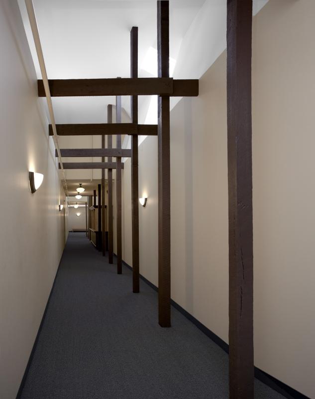 Interior hallway with clerestory windows and exposed posts and beams