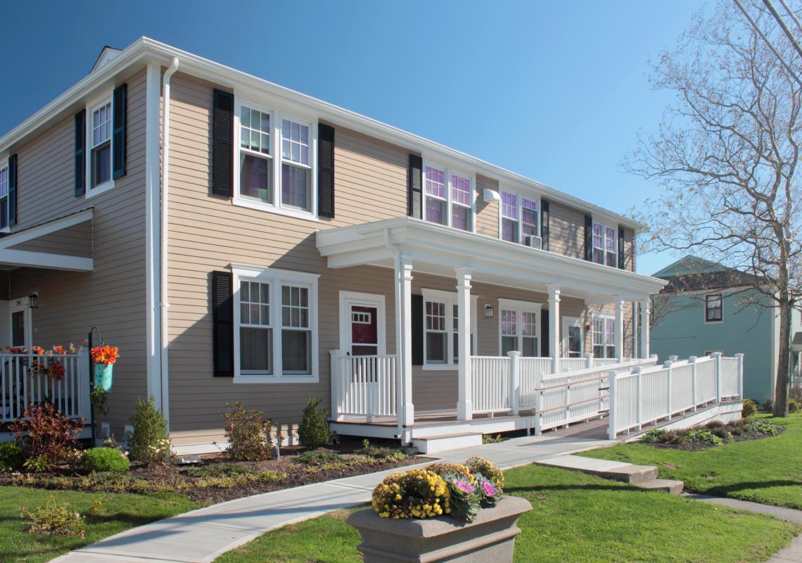 Front building exterior with accessible ramp and porch