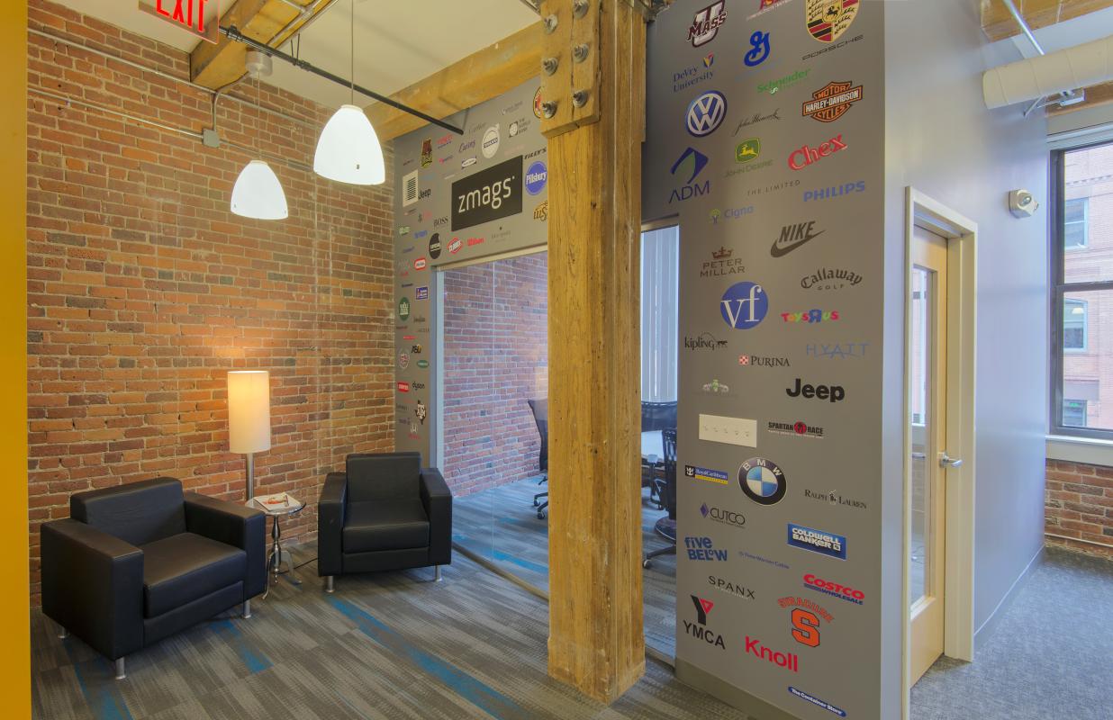 Reception area with wall of client logos