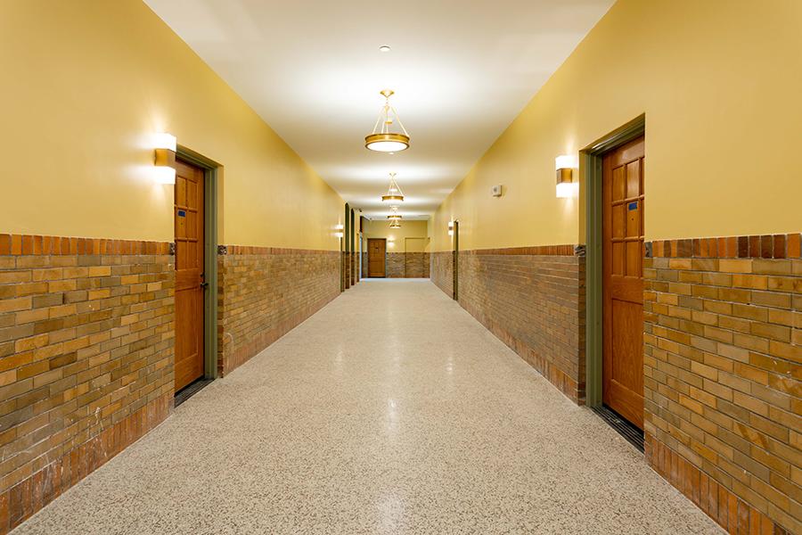 Hallway with brick wainscoting.